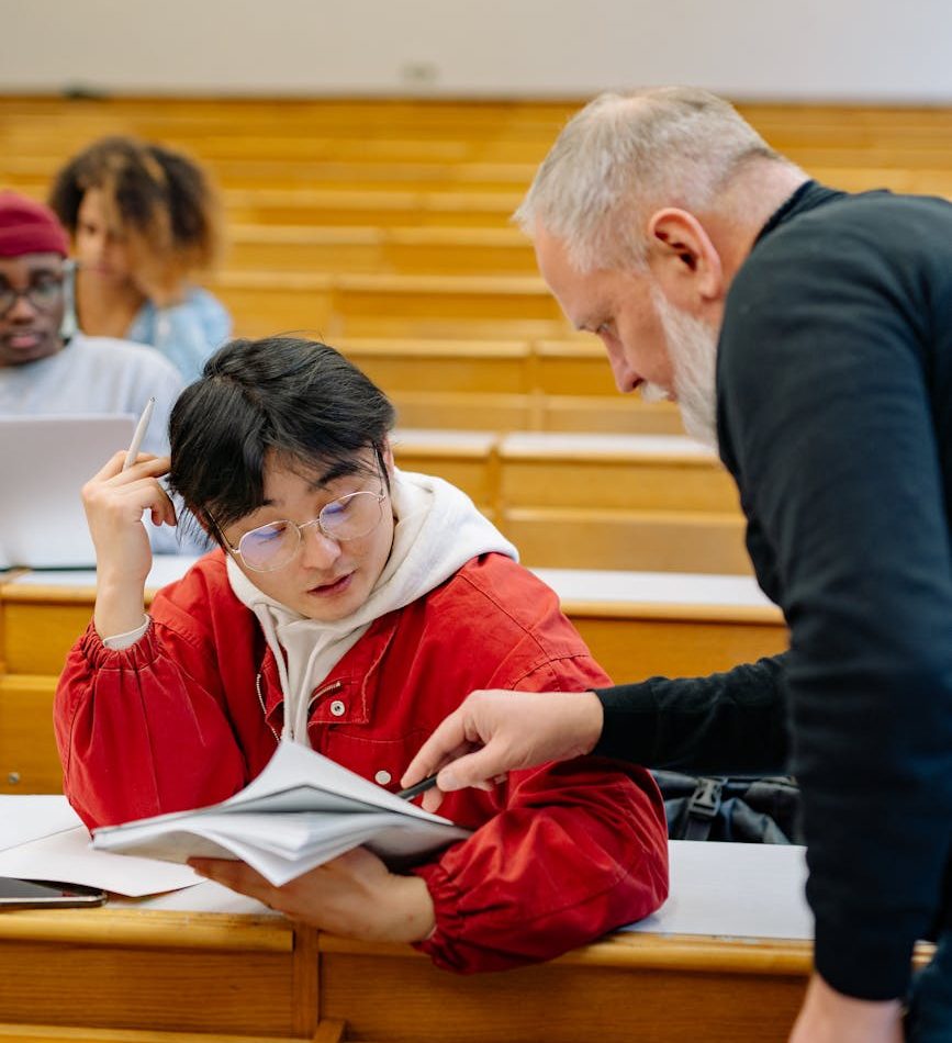 professor helping student at university